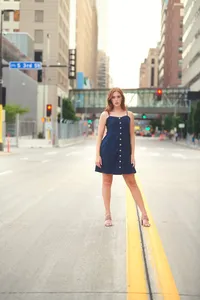 Bold urban senior portrait of a teen standing in the middle of an empty Minneapolis street by Megan Engeseth Photography