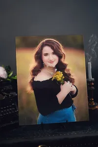 Senior portrait album spreads showing outdoor and studio session images in lay-flat format