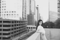 Artistic city senior photos of a teen with the St. Paul Cathedral in the background by Megan Engeseth Photography