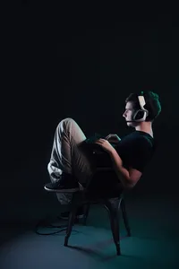 Modern senior portrait featuring bold styling and confident expression playing video games