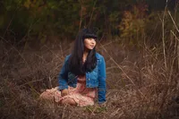 outdoor senior portrait at Minnehaha Falls Minneapolis natural scenery