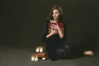 Senior Picture Photographer Captures Thoughtful Portrait With Books And Candles-30
