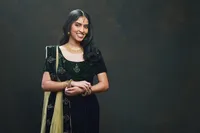 Fashion-forward senior portrait with structured posing in studio in indian garb