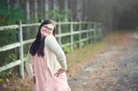 high school senior girl portrait in tall grass field Minnesota