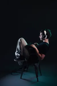 Video game senior pictures in Minneapolis with bold editorial styling and confident gamer pose