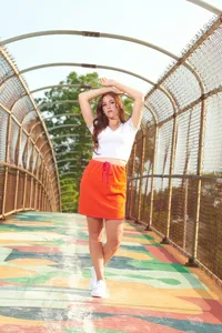 Minneapolis senior picture photographer capturing a high school girl mid-laugh on a busy city sidewalk by Megan Engeseth Photography
