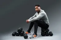 Branding portrait for fitness or wellness professional with authentic expression and natural styling