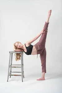 Dramatic dance senior pictures with expressive movement and bold studio lighting in Minneapolis