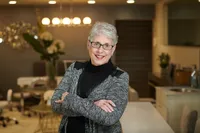 Confident professional photographed during guided business headshot session in Minneapolis studio