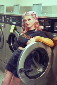 High School Senior Portrait of Stylish Teen in Laundromat Setting-15