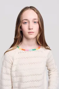 Teen Model headshot of girl with fun sweater and rainbow colors