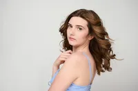 Senior girl photographed in indoor studio with dramatic lighting and magazine-inspired composition
