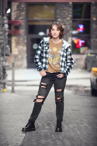Twin Cities senior portrait of a confident teen in all black against a stark urban backdrop by Megan Engeseth Photography