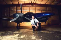 High School Senior Portrait Photographer With Airplane Concept in Minnesota
