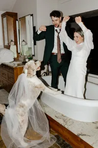 Couple dancing in clawfoot bathtub during their Holland, Michigan wedding celebration