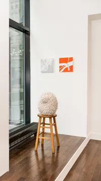 egg sculpture near a window