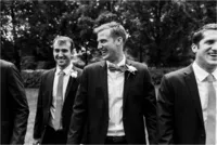 groom smiling with groomsmen