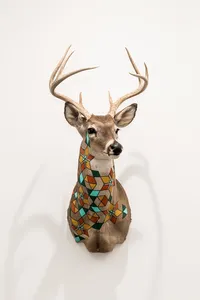 painted deer artwork on a white wall