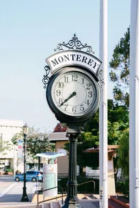 Ornate Monterey street clock on a downtown corner in morning light