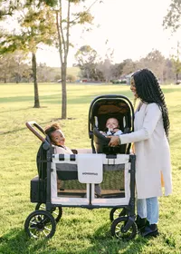 Commercial lifestyle brand photography for Wonderfold showcasing a modern family using a premium stroller wagon outdoors