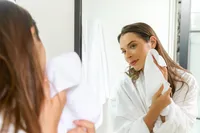 Lifestyle-forward commercial photography showcasing a skincare routine for a premium wellness brand campaign