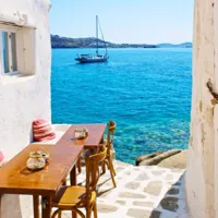 Chelsea Loren Travel & Leisure Photographer capturing Mykonos, Greece sailboat ocean alleyway