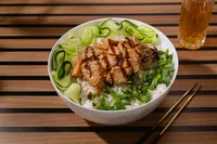 Natural Catch teriyaki coho salmon over rice with cucumber ribbons, scallions, and sesame, tinned fish serving suggestion