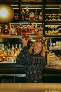 Bartender pouring at the Lobby Bar's back bar