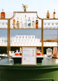 Styled bar area photographed at a brand event, showcasing signage, product placement, and guest experience