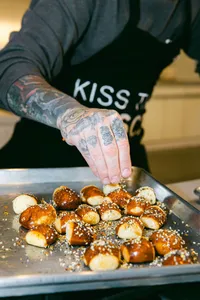 Everything seasoning sprinkled over a tray of pretzel bites