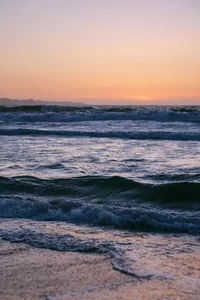 Sunset over breaking surf on the Monterey coastline