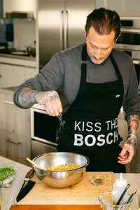 Michael Voltaggio seasoning a mixing bowl at the prep counter