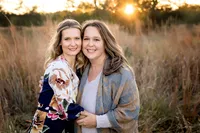 picture of family in a field of grass at sunset at Phil Hardberger park in San Antonio