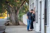 Couple kissing outside of Gruene Hall in New Braunfels
