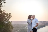 Couple kissing at the overlook at Mount Bonnell in Austin during family photo session