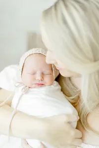 Beautiful close up photo of a mother holding her newborn baby girl.