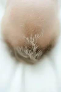 Close up detail photo of a newborn boys hair