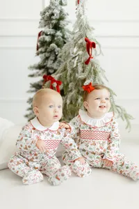 Professional branding photo of 2 babies modeling Dondolo christmas clothing