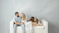 Family of four portrait indoor in the Dallas–Fort Worth area studio
