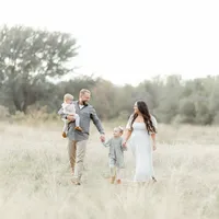 Family of 4 in a field in Flower Mound, Texas by Kate Marie Portraiture