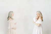 Before and after photo of a mother posing for an in studio maternity session and along side is a photo edited in with her holding her newborn baby girl.