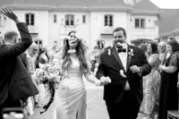 Bride and groom walking down the aisle celebrating with guests in Huntsville, Alabama.