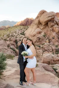 Engaged couple smiling at the Red Rock Canyon in Nevada
