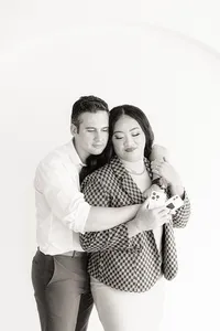 Two people hug one another