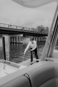 Groom tying boat to dock