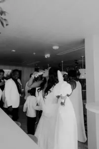 Bride drinking champagne at her San Diego wedding