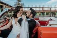 Bride and groom in retro car at The Sure Thing Chapel in Las Vegas, Nevada