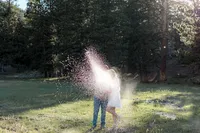 The couple is engulfed in a shimmering spray of champagne
