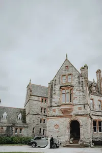 Bride and groom in front of the Castle in Leslie, Ireland