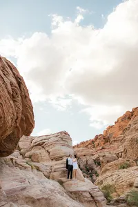 Portrait image of engaged couple on a rock at the Red Rock Canyon